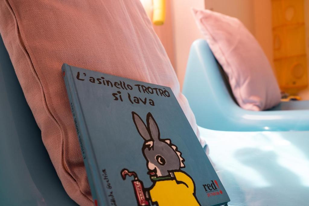 Postel nebo postele na pokoji v ubytování Hotel Tigullio