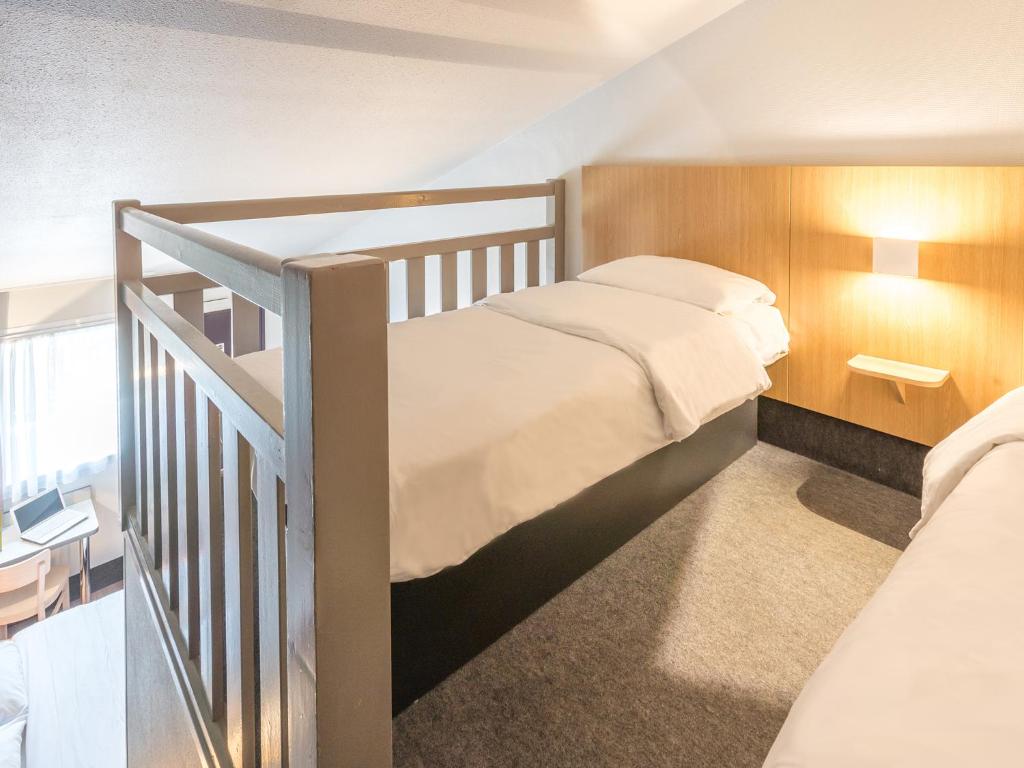 Postel nebo postele na pokoji v ubytování B&B HOTEL Strasbourg Sud Geispolsheim