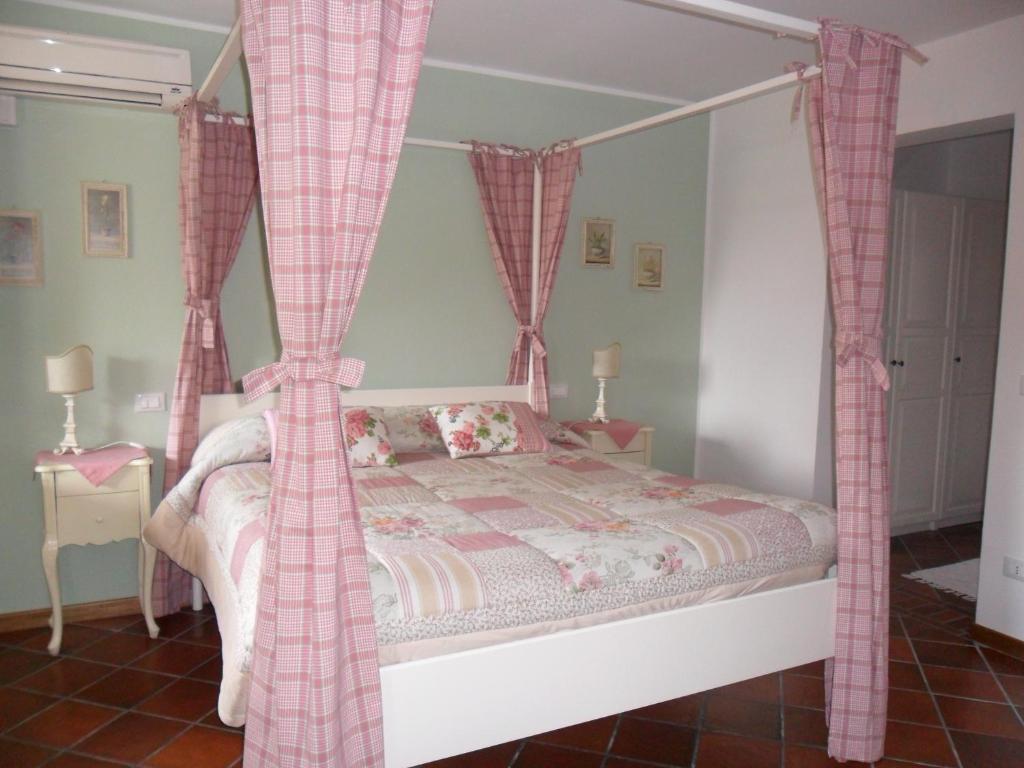 Postel nebo postele na pokoji v ubytování Ca' Borgo delle Rane