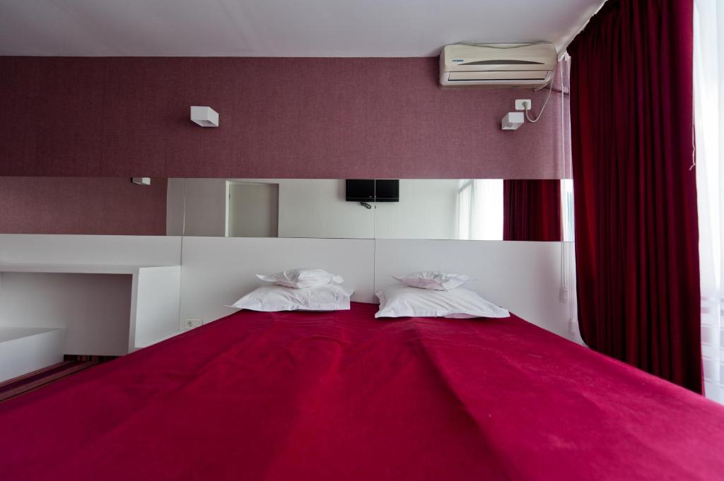 Postel nebo postele na pokoji v ubytování Hotel Opal