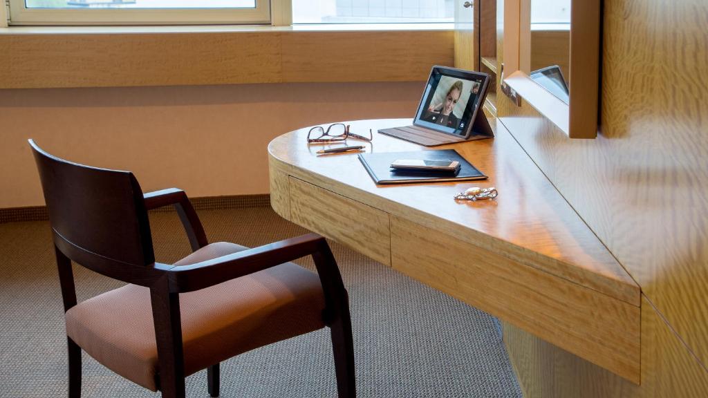 Televízia a/alebo spoločenská miestnosť v ubytovaní Enea Hotel Aprilia