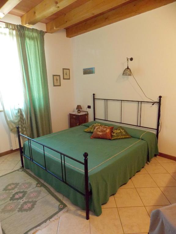 Letto o letti in una camera di Le Bianchette Agriturismo e Fattoria Didattica