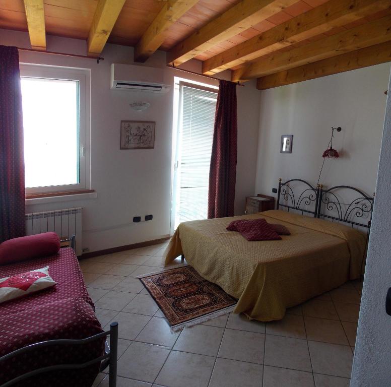 Letto o letti in una camera di Le Bianchette Agriturismo e Fattoria Didattica