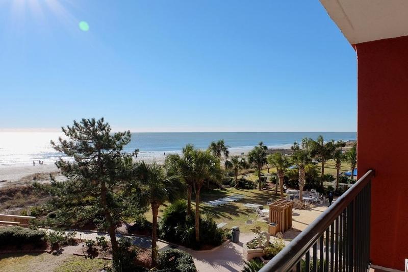 a view of the beach from a balcony of a resort at Beach Colony Ocean Front Executive Suite in Myrtle Beach