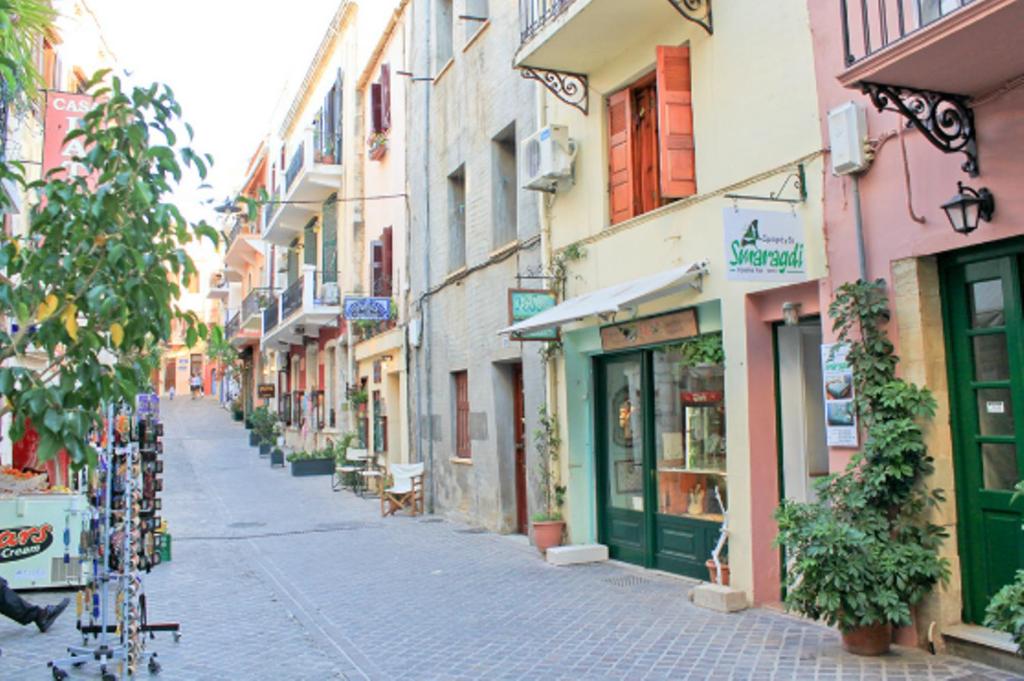 an empty street in a city with buildings at Smaragdi in Chania