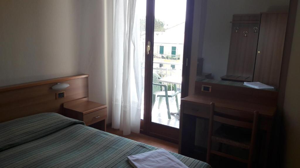 Voodi või voodid majutusasutuse Hotel Residence Moneglia toas