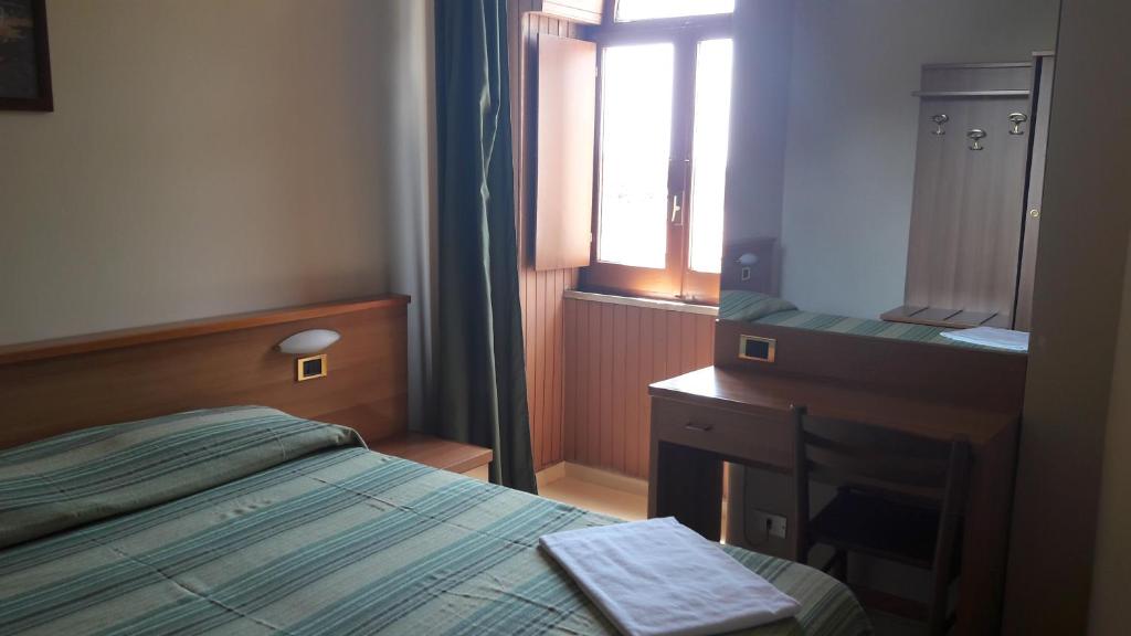Voodi või voodid majutusasutuse Hotel Residence Moneglia toas