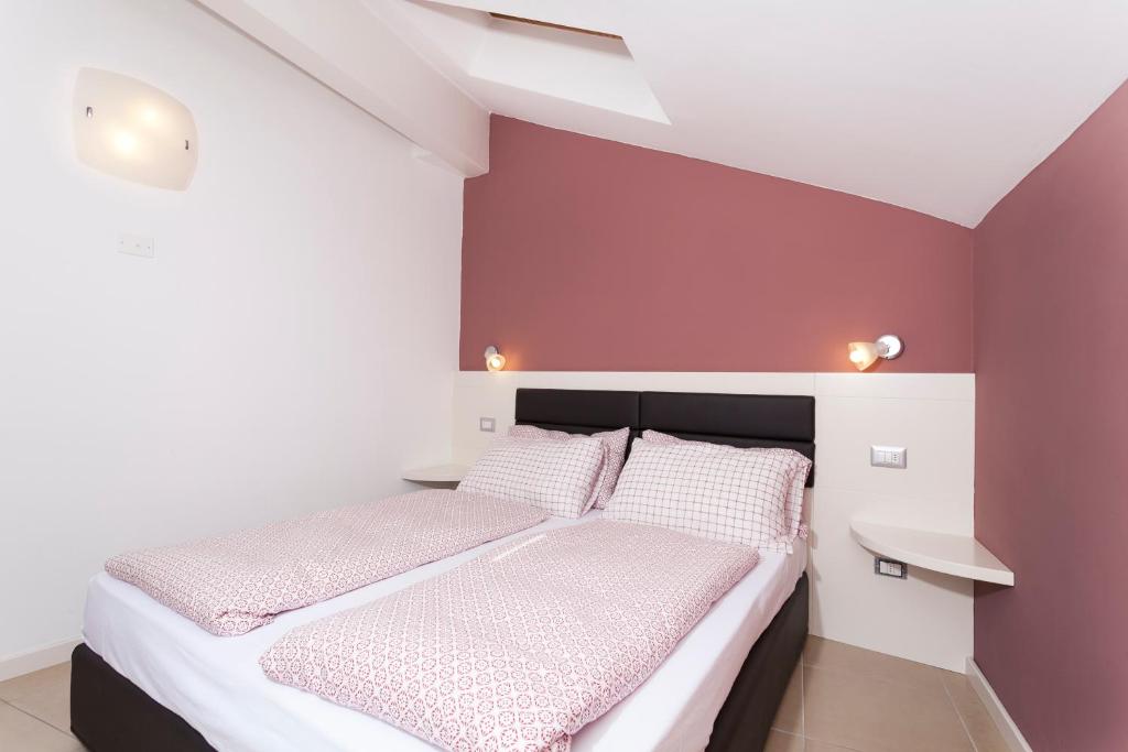 Postel nebo postele na pokoji v ubytování Residenza Al Cadin