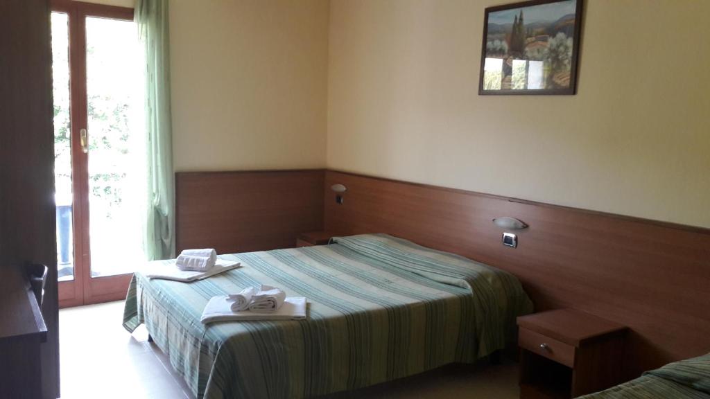 Voodi või voodid majutusasutuse Hotel Residence Moneglia toas