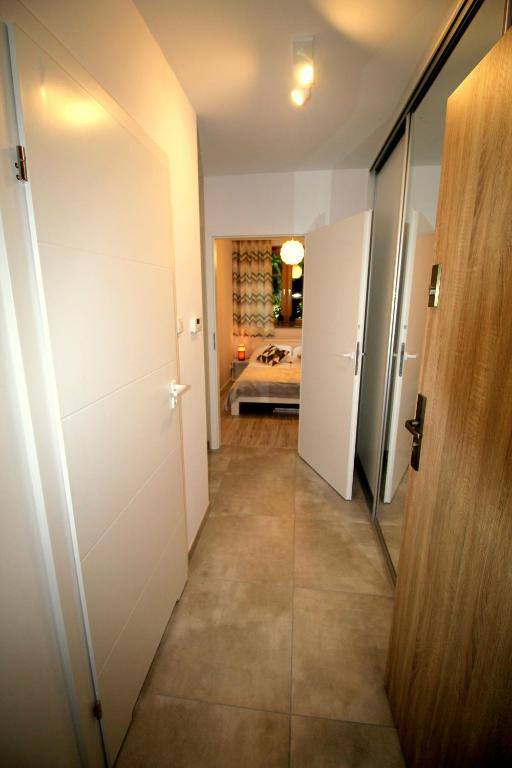 Posteľ alebo postele v izbe v ubytovaní Apartamenty Podgorze