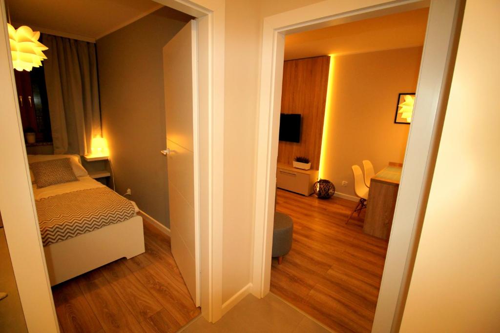 Posteľ alebo postele v izbe v ubytovaní Apartamenty Podgorze