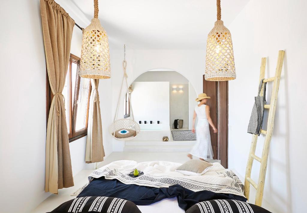 A bed or beds in a room at Le Blanc Suite