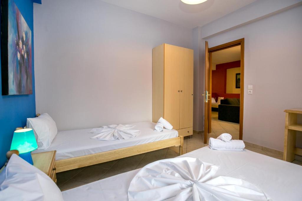 Postel nebo postele na pokoji v ubytování Grande Apartments