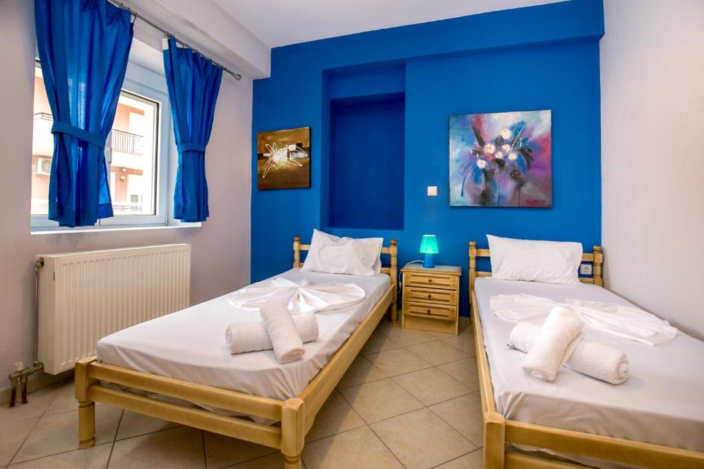 Postel nebo postele na pokoji v ubytování Grande Apartments