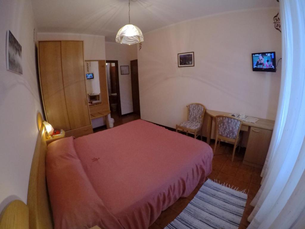Postel nebo postele na pokoji v ubytování Hotel Ristorante Combolo