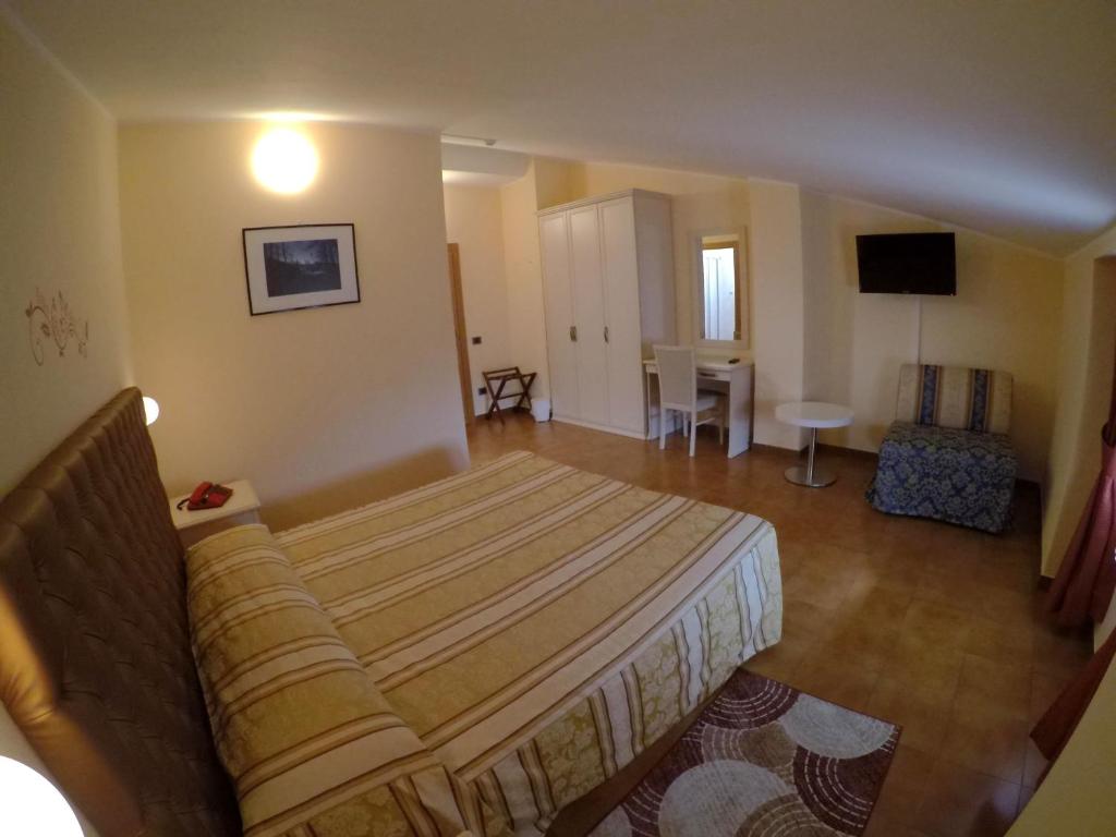 Postel nebo postele na pokoji v ubytování Hotel Ristorante Combolo