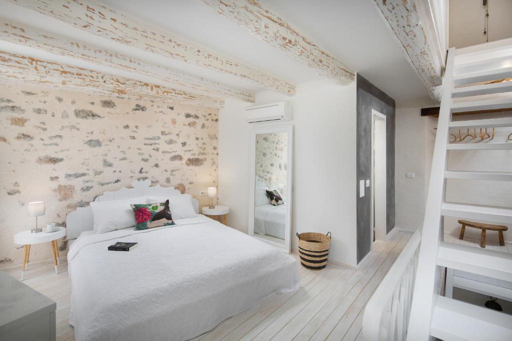 Postel nebo postele na pokoji v ubytování Casa Pharus