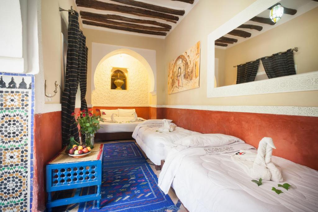 Postel nebo postele na pokoji v ubytování Riad Zanzibar