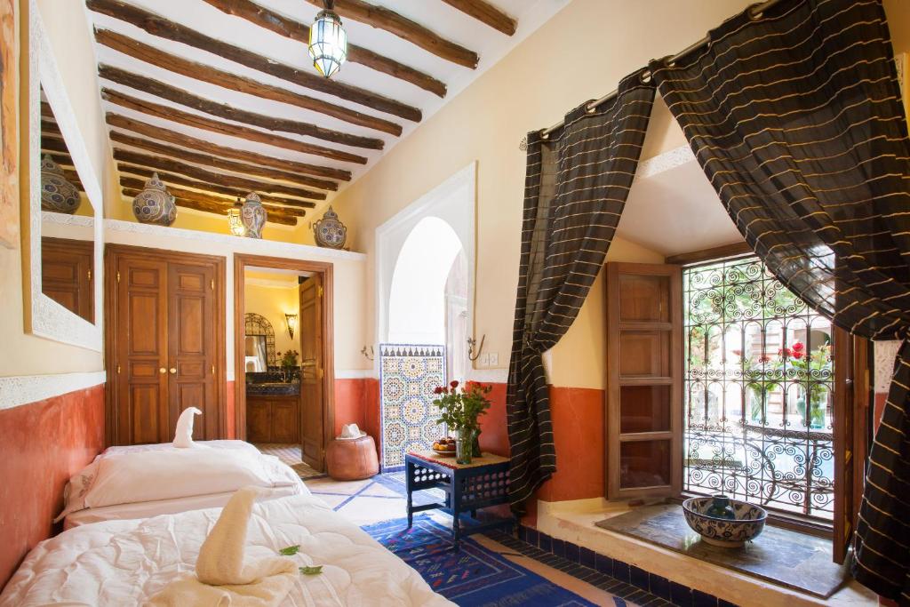 Postel nebo postele na pokoji v ubytování Riad Zanzibar