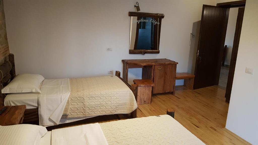 Postel nebo postele na pokoji v ubytování Hotel Bujtina Ollga