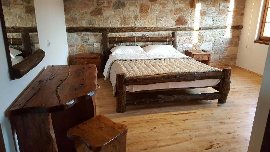 Postel nebo postele na pokoji v ubytování Hotel Bujtina Ollga