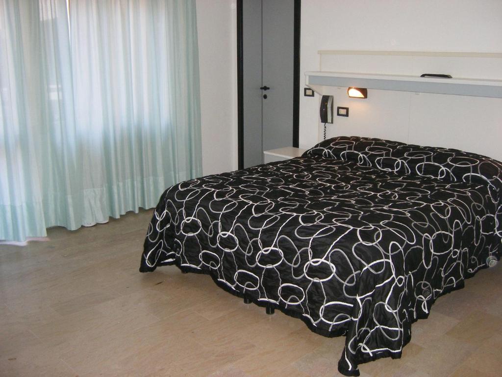 Postel nebo postele na pokoji v ubytování Hotel Belvedere