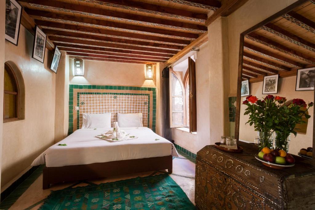 Postel nebo postele na pokoji v ubytování Riad Zanzibar