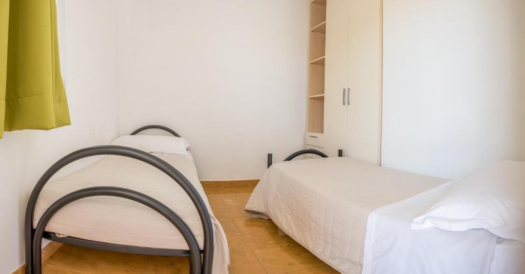 Postel nebo postele na pokoji v ubytování Donnosanto Residence