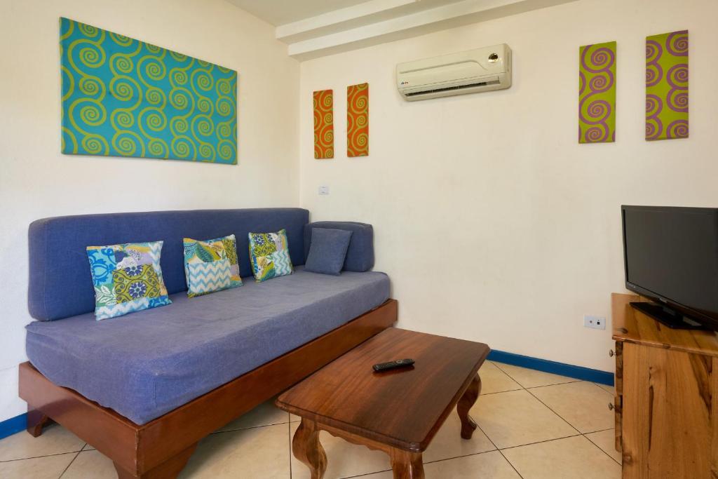 TV a/nebo společenská místnost v ubytování Tamarindo Blue Apartments