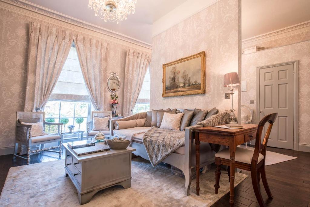 a living room with a couch and a table at Church Apartment in Shrewsbury