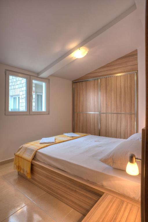Postel nebo postele na pokoji v ubytování Guest House Maslina