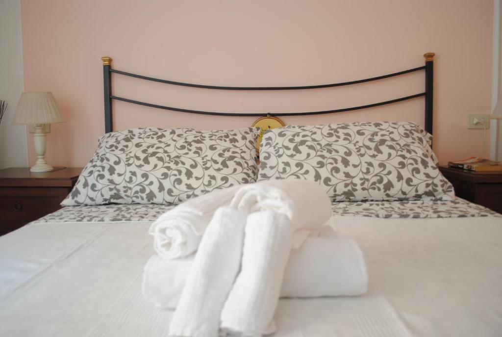 Llit o llits en una habitació de Dreaming Navona Rooms