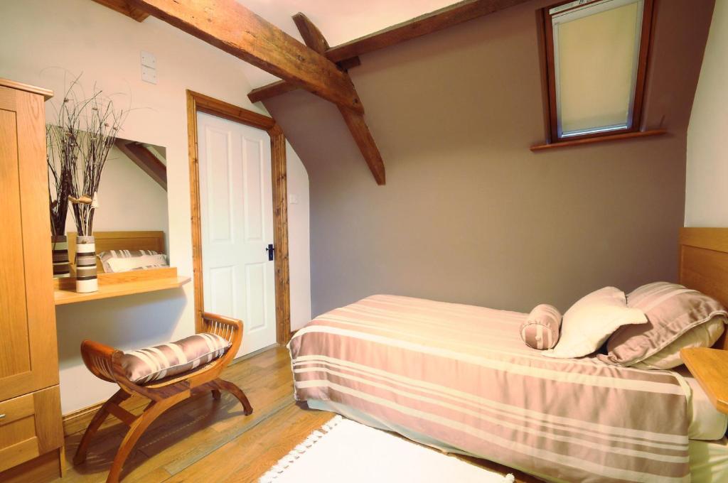 Postel nebo postele na pokoji v ubytování Stirabout Lane B&B