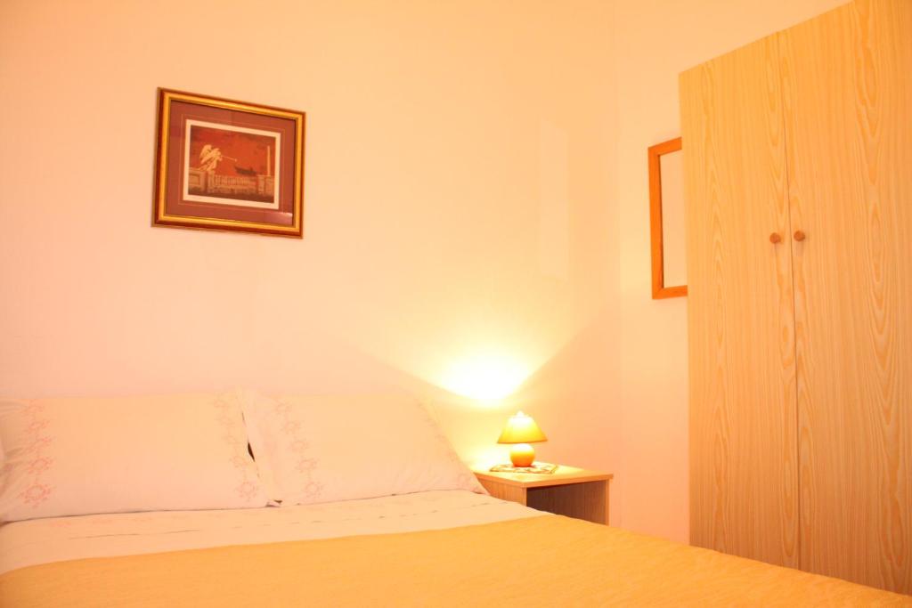 Postel nebo postele na pokoji v ubytování Apartment Anand