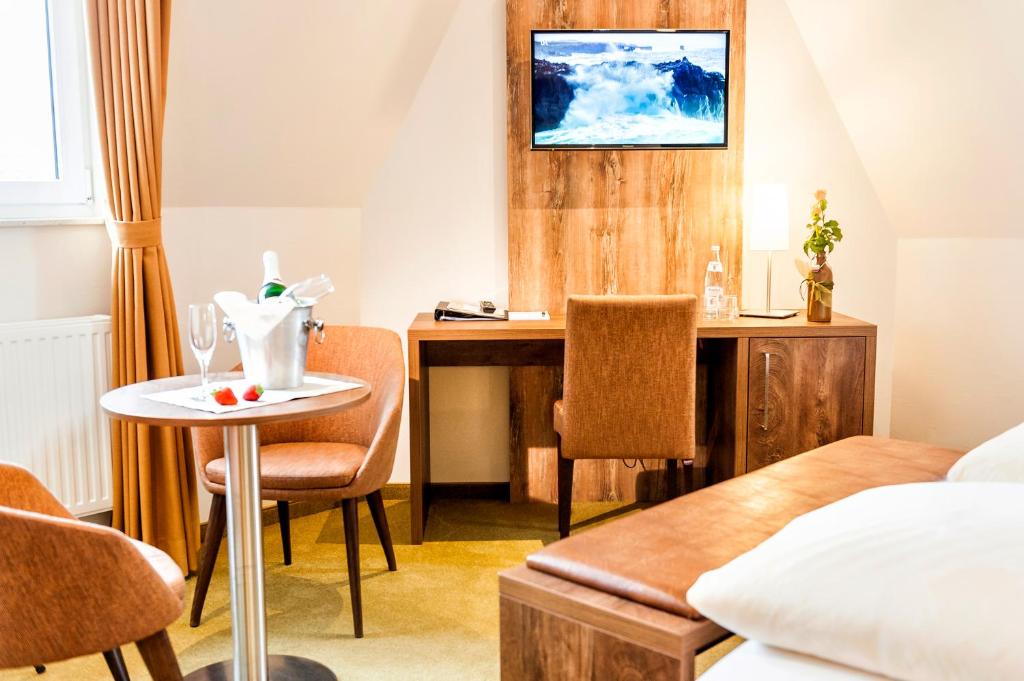 Postel nebo postele na pokoji v ubytování Hotel Hilker