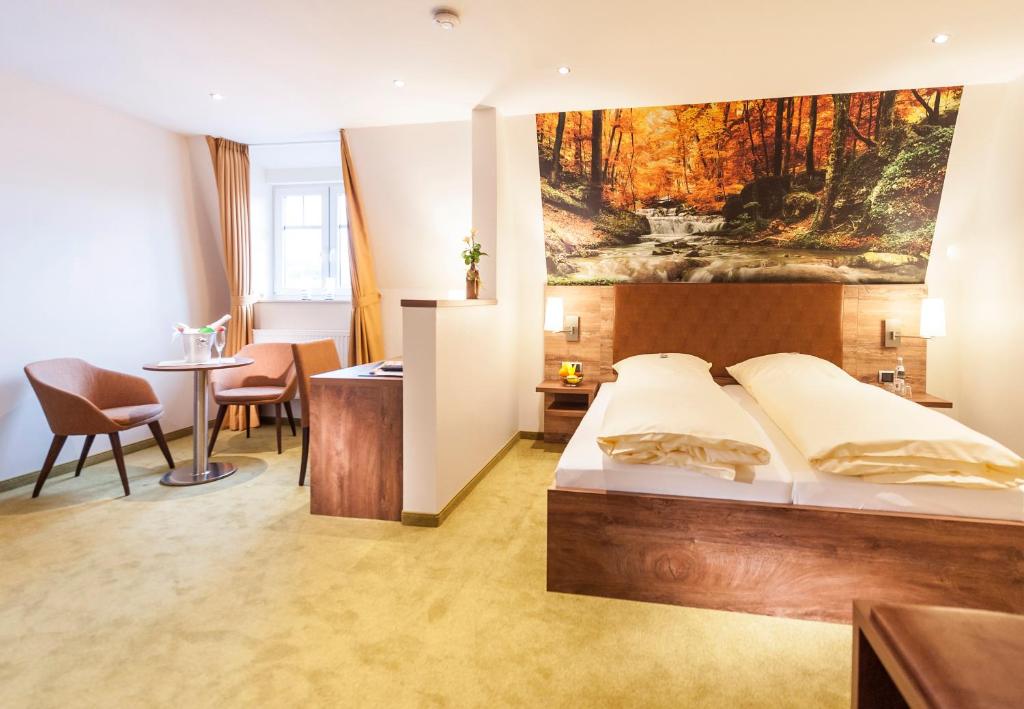 Postel nebo postele na pokoji v ubytování Hotel Hilker