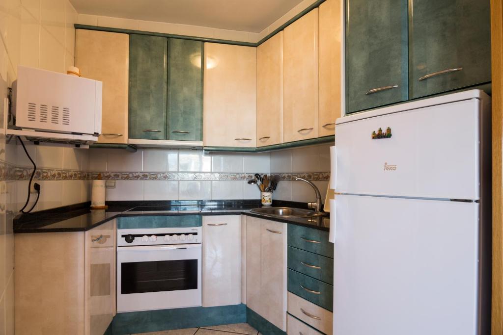 Kuchyň nebo kuchyňský kout v ubytování Calafell Apartment 2