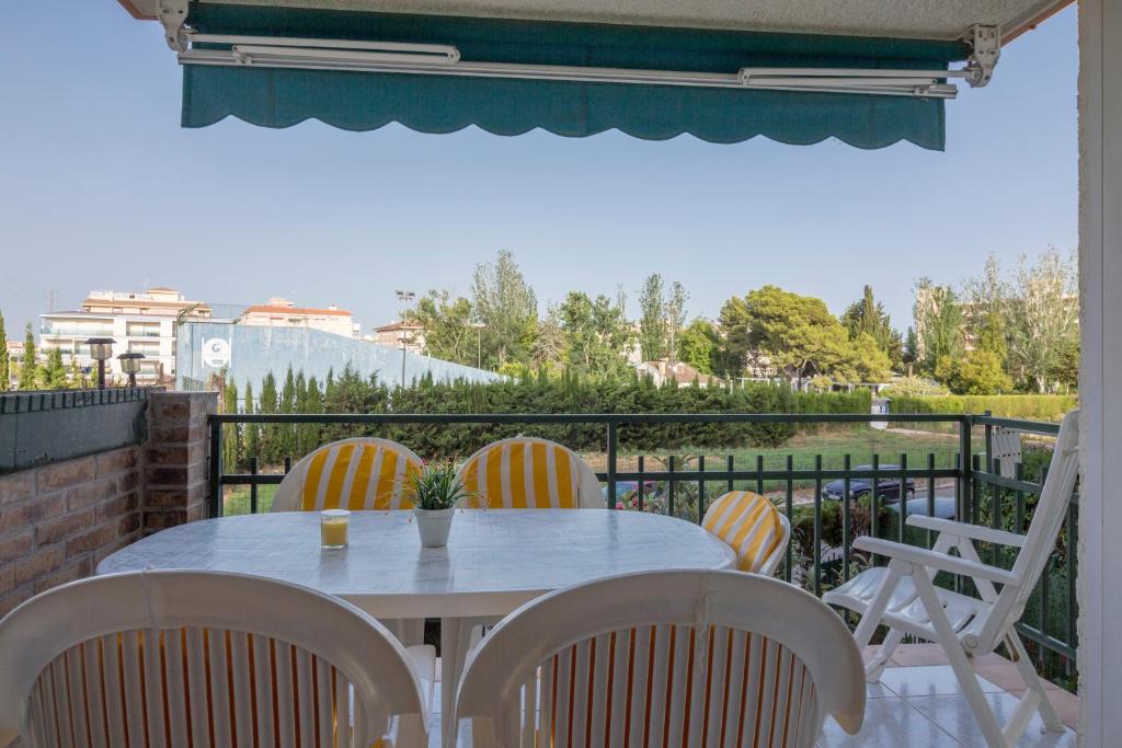 a table and chairs on a balcony with a view at Calafell Apartment 2 in Calafell