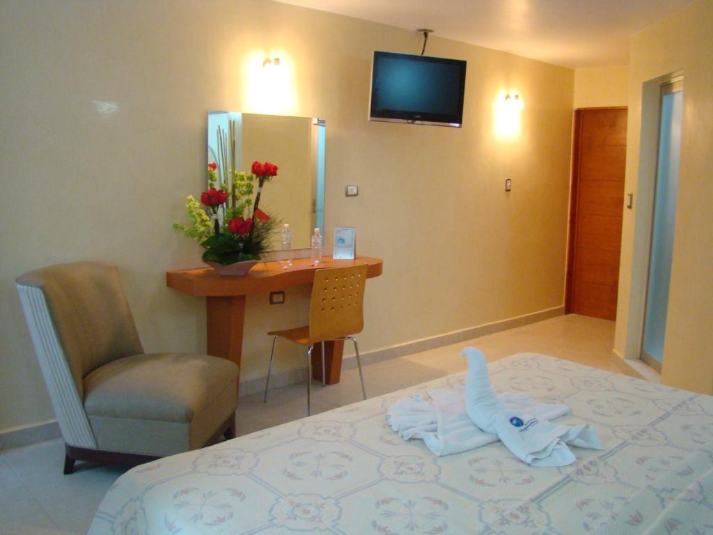 Postel nebo postele na pokoji v ubytování Auto Hotel Mediterráneo