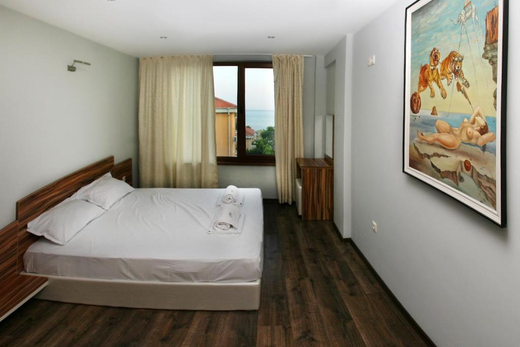 Postel nebo postele na pokoji v ubytování JBH Hotel
