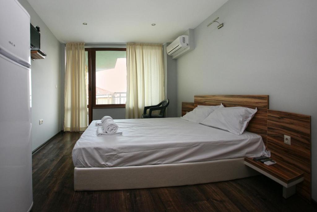Postel nebo postele na pokoji v ubytování JBH Hotel