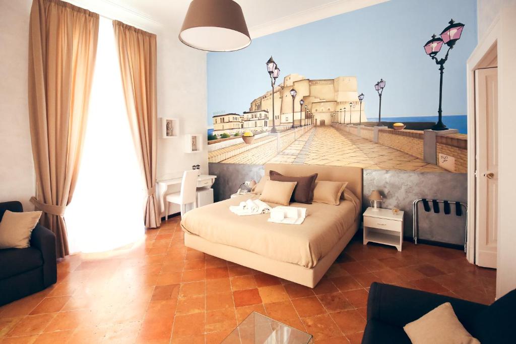 Postel nebo postele na pokoji v ubytování NapoliMia Boutique Hotel