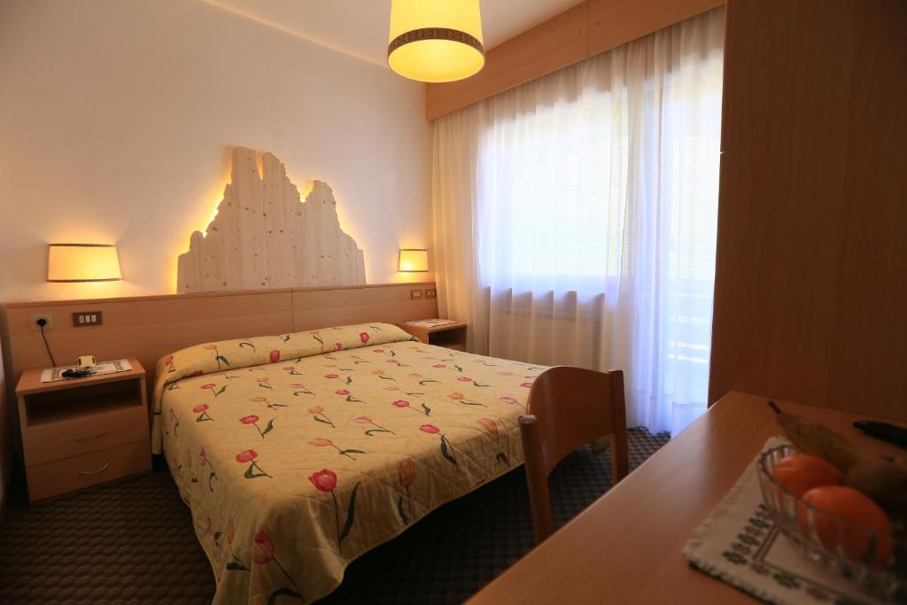 Postel nebo postele na pokoji v ubytování Hotel Miramonti