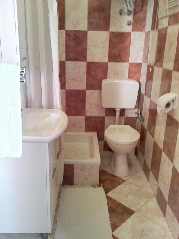 Kúpeľňa v ubytovaní Apartmani Poljanec