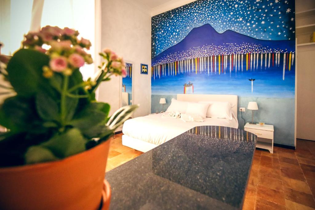 Postel nebo postele na pokoji v ubytování NapoliMia Boutique Hotel
