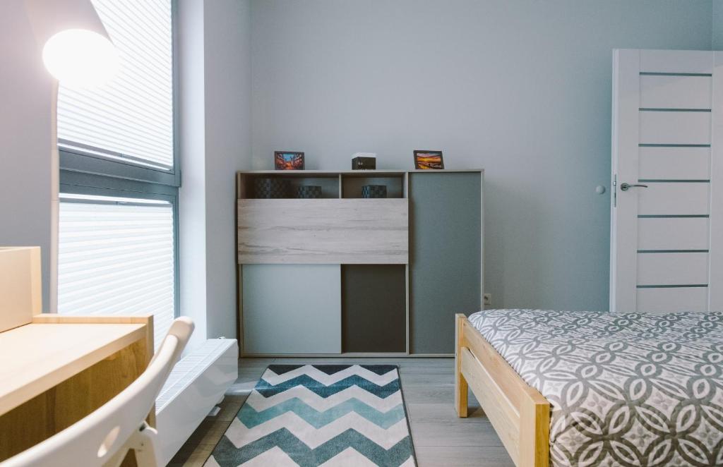 Posteľ alebo postele v izbe v ubytovaní Apartamenty Rodzina nad morzem