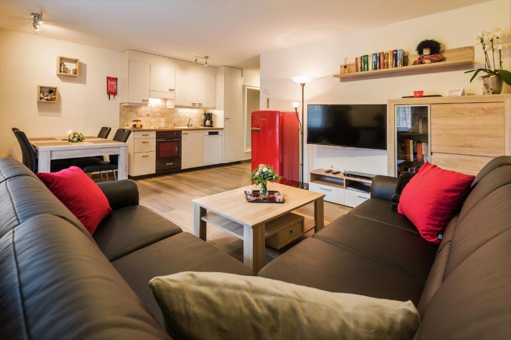 a living room with a couch and a table at Haus Adora in Saas-Almagell