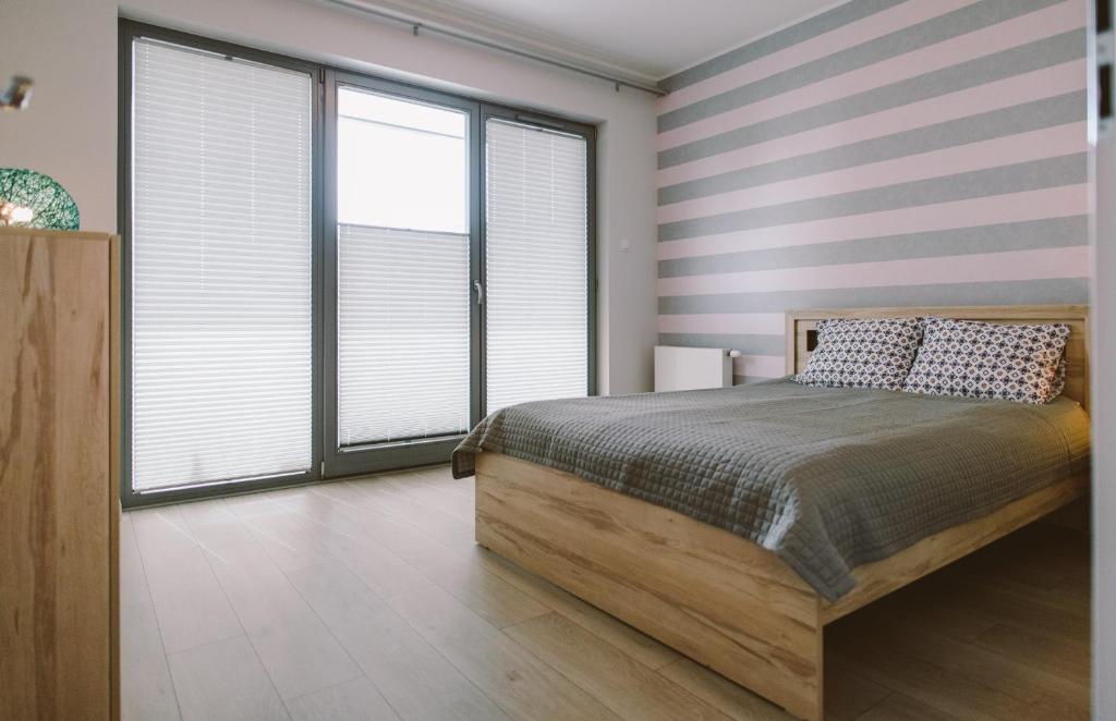 Posteľ alebo postele v izbe v ubytovaní Apartamenty Rodzina nad morzem