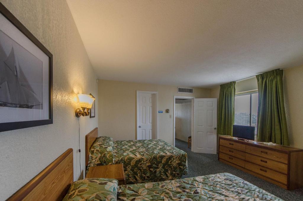 Postel nebo postele na pokoji v ubytování Attache Motel