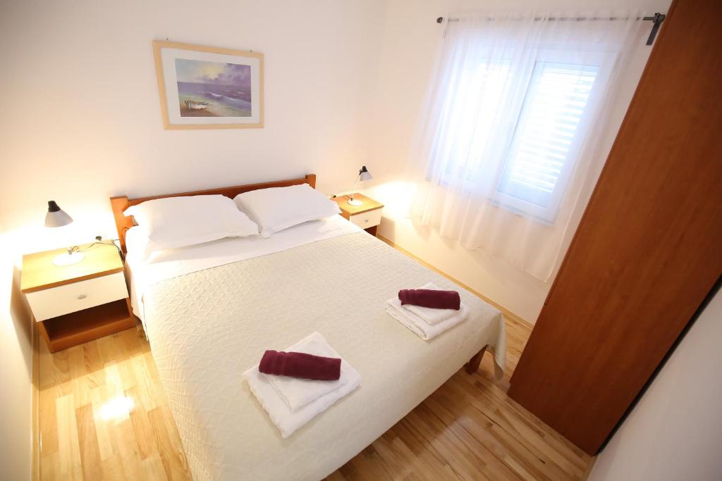 Łóżko lub łóżka w pokoju w obiekcie Villa Goga
